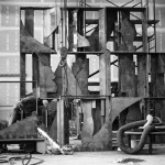 Louise Nevelson’s Sky Covenant, 1973, during fabrication at the shop. The interiors of the boxes were made individually, and the boxes were bolted together to assemble the completed sculpture. The worker at the lower left is grinding the edges of one of the interior components, so they fit together properly.