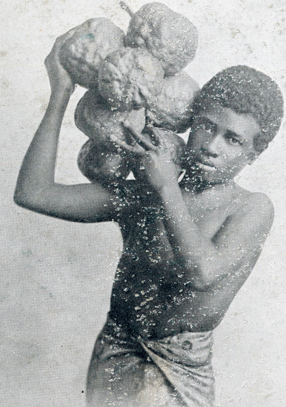 Young_man_carrying_fruit_of_a_breadfruit_tree,_Fiji,_ca.1900-1930