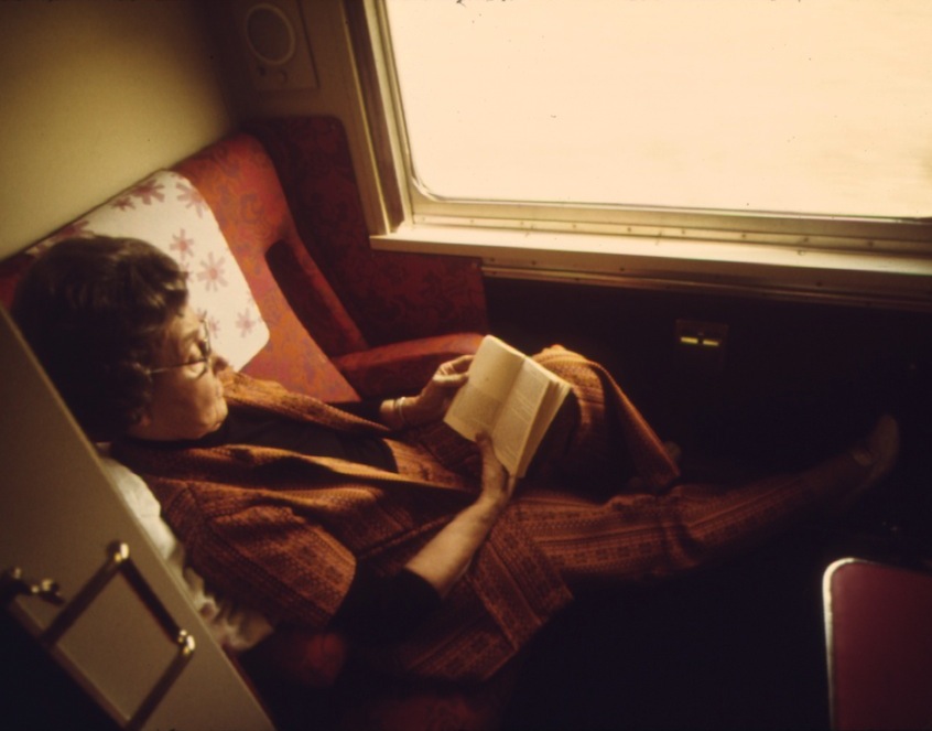 A_PASSENGER_ON_THE_LONE_STAR_PASSES_THE_TIME_READING_IN_HER_COMPARTMENT_AS_THE_TRAIN_CROSSES_OKLAHOMA_ENROUTE_FROM..._-_NARA_-_556033