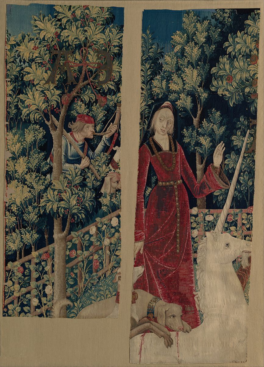 The unicorn rests top in a garden tapestry
