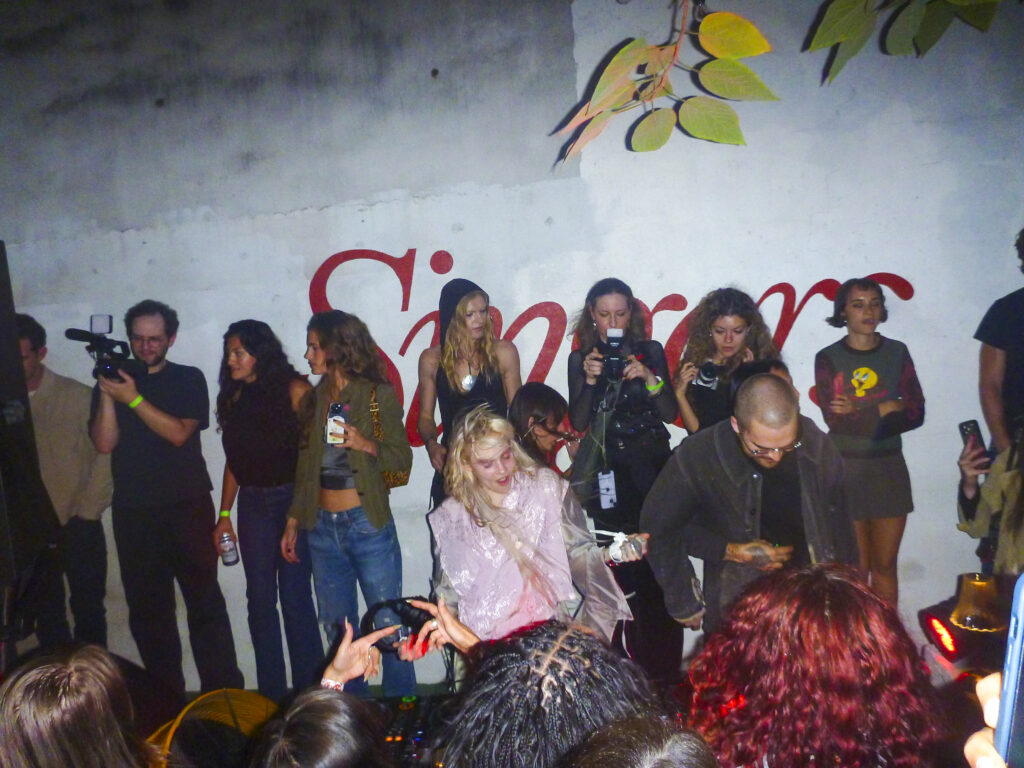 Grimes DJing at Singers.
